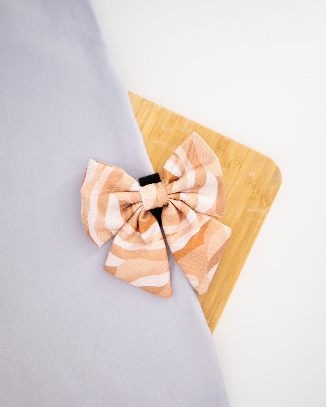 Dog sailor bowtie with a beige abstract pattern