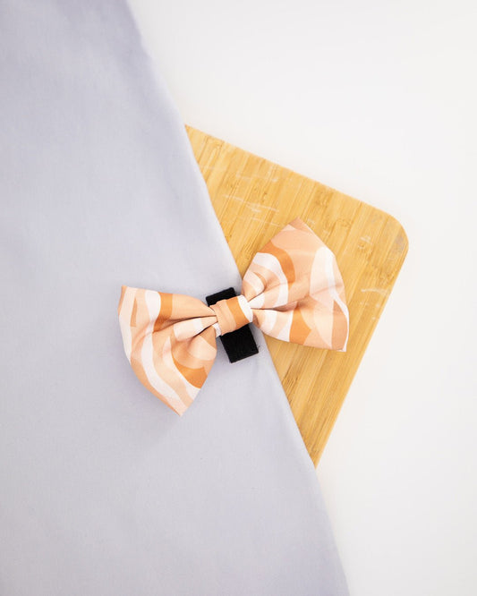 Dog bowtie with a beige abstract pattern